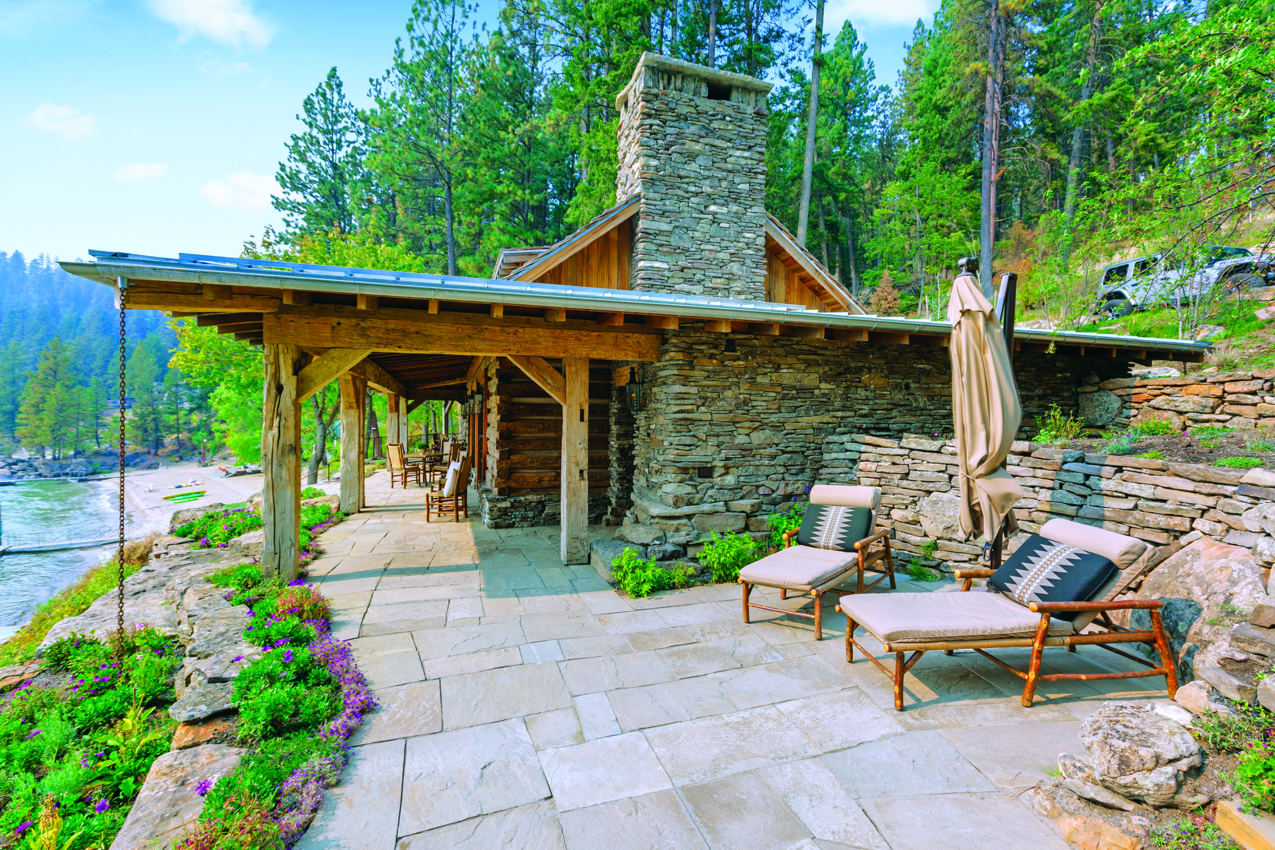 The design team salvaged old barn timbers to build the main cabin that appears constructed in the early 1900s. “The homeowners wanted it to feel old, which meant buying old,” architect Shelli Mittmann says. | Photo: Mike McCall
